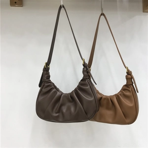 Ruched cloud shoulder bag in dark and light brown leather with pleated crescent design