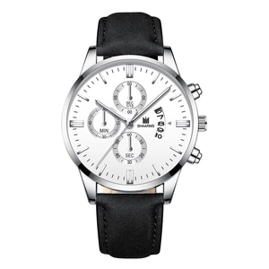 Detailed macro view of white dial with triple sub-dials and calendar window on silver watch