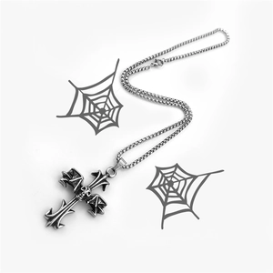 Silver stainless steel bat cross necklace with skull wings on white background