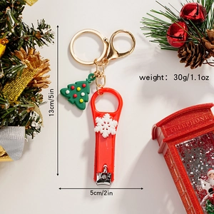 Christmas snowman nail clipper keychain with colorful tree charm and dimension scale detail
