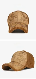 Detailed view of dark coffee suede baseball cap with rhinestone bow and sherpa lining