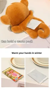 Detail of plush orange hand warmer with back pocket for heat pads and fluffy texture