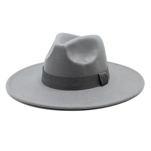 Detail of a dark grey wide brim wool fedora with a matching ribbed ribbon decorative band