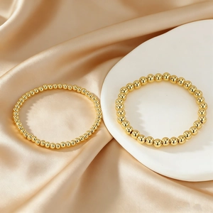 Minimalist 18K gold plated copper bead elastic bracelet set with polished finish