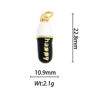 Detail of 18k gold plated capsule pendant with happy lettering and enamel finish
