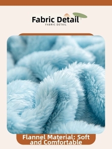 Detailed close-up of soft light blue flannel jacquard fabric texture on a warm blanket