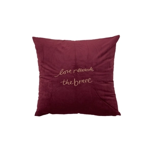 Burgundy velvet square cushion cover with gold embroidered love rewards the brave text