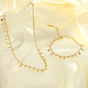 Elegant 18K gold-plated stainless steel necklace and bracelet set with tassel charms