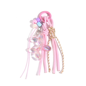 Porte-clés en corde rose avec perles colorées et breloque chien ballon holographique