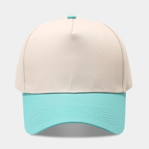 Detail showing beige crown and mint green brim of the five-panel cotton baseball cap