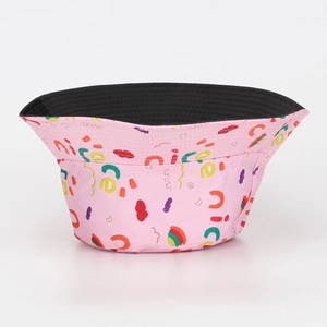 Detail view of pink bucket hat featuring colorful nice lettering and black inner lining