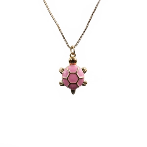 Minimalist gold plated turtle necklace with pink enamel shell on white background