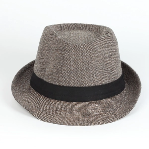 Detail of multi-color woven fedora hat featuring a retro texture and black fabric ribbon