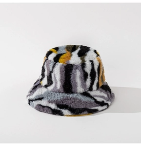 Detail of plush faux fur bucket hat featuring a zebra and leopard print pattern