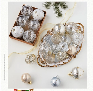 Close-up of elegant gold and silver Christmas ornaments in a vintage tray decoration