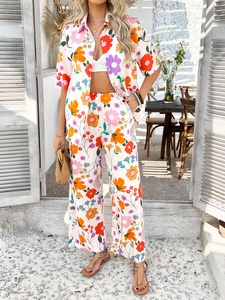 Women's colorful floral vacation set with short sleeve shirt and wide-leg trousers