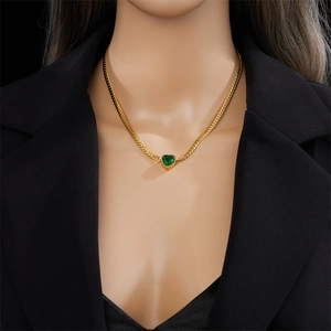 Fashionable gold-plated heart pendant necklace with green gemstone on flat curb chain