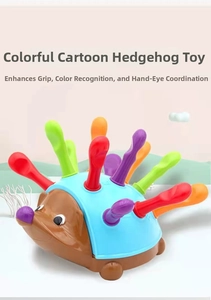 Macro detail of colorful plastic pegs and rounded hedgehog toy for fine motor skill training