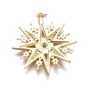 Macro detail of gold eight-pointed star pendant with intricate cutout metal structure