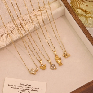 Elegant gold titanium steel necklace with butterfly and flower pendants and rhinestones