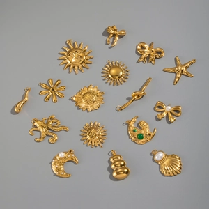 Detailed assortment of 18K gold plated stainless steel sun, moon, and sea life DIY charms