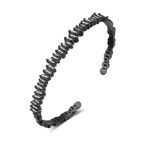 Detail of adjustable black bangle with rectangular zircons in a single row setting