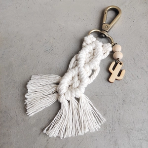Handmade macrame keychain with cotton tassels, wooden beads, and a cactus charm pendant