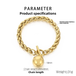 Detailed view of golden stainless steel curb chain bracelet with toggle clasp and ball pendant