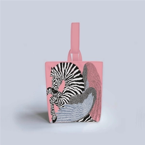 Detail of pink Van Gogh bucket bag featuring zebra and colorful wing patterns