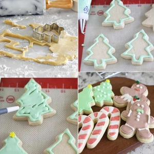Macro view of Christmas stainless steel cookie cutters in gingerbread and tree shapes