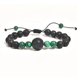 Detail of adjustable woven lava stone bracelet with green malachite beads on white background