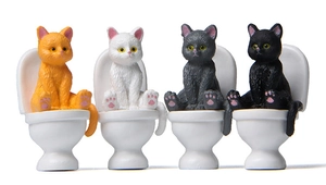 Detailed set of four miniature resin cat figurines sitting on toilets in various colors