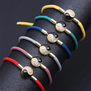 Colorful woven Yin Yang bracelets with gold metal accents and zircon inlay detail