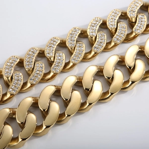 Macro detail of gold plated Cuban dog collar showing clear diamond studs and metal links