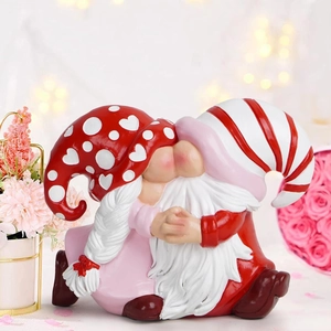Close-up of kissing resin gnomes figurines with red hats for Valentine's home decor