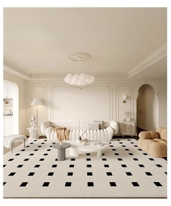 Detailed texture of French-style cream carpet with black geometric patterns in a living room