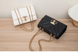 Close-up of elegant V-quilted crossbody bags with gold chain straps and T-shaped locks