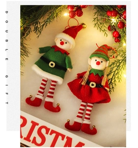 Detailed view of plush Christmas elf ornament with festive bells in a cozy holiday scene