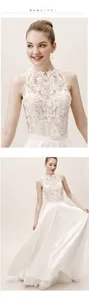 Detail of elegant white lace halter neck bodice with satin skirt for bridal wear