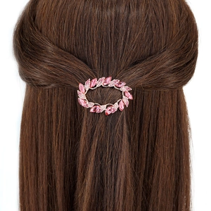 Pink crystal leaf hair clip on brown hair showing stylish half-up hairstyle