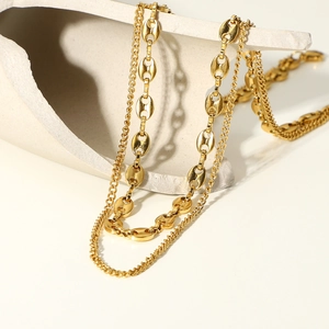 Double-layer 18K gold plated necklace with cuban link and oval bean chain on stone