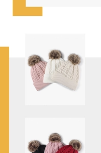 Detail of cable knit texture and faux fur pompom on various colorful winter beanies