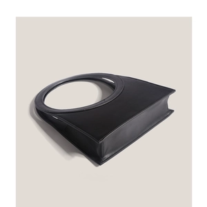 Chic black handbag with a circular top handle and sleek leather finish for women
