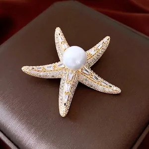 Exquisite 14K gold plated starfish brooch with a large white pearl and zircon inlay