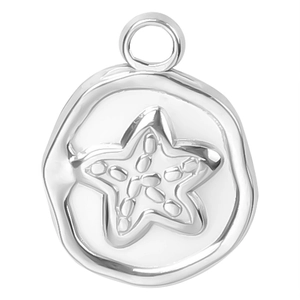Macro shot of silver stainless steel starfish pendant with embossed ocean pattern