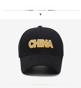 Detailed close-up of yellow CHINA letter embroidery on black cotton baseball cap