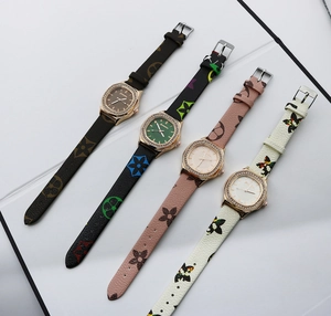 Detailed view of four square ladies quartz watches with rhinestone bezels and floral bands