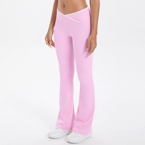Close-up of pink high-waist yoga flare pants with V-shaped crossover white edge waist design