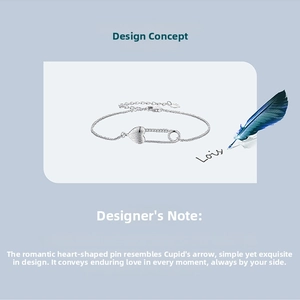 Detail of s925 silver heart safety pin bracelet with zircons and brushed metal texture
