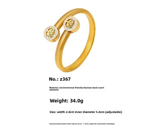 Detail view of gold Tree of Life bracelet showing 2.8cm width and 34g weight specs